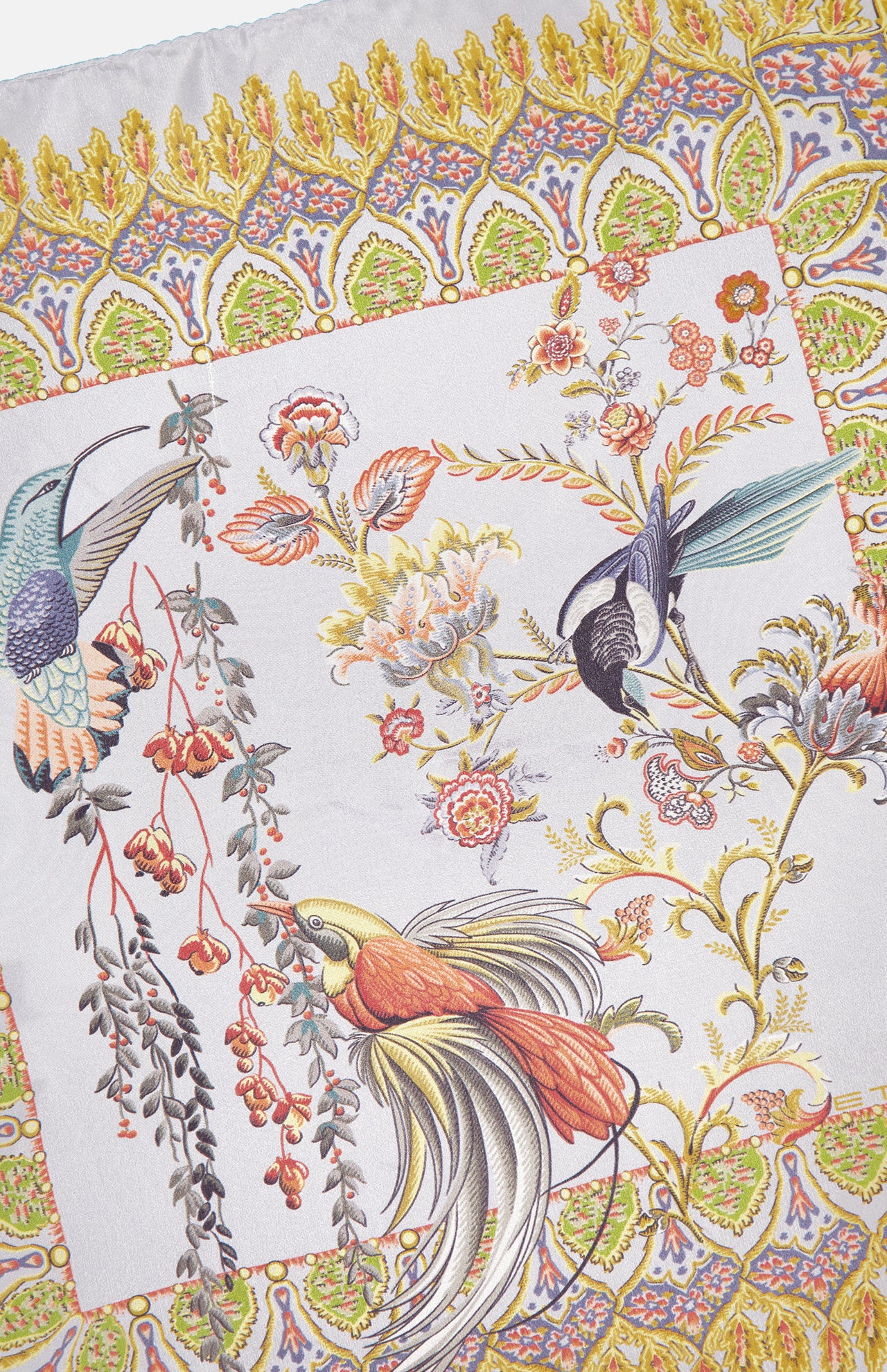 The ETRO Bird Print Pocket Square features a symmetrical, ornate design with colorful birds, flowers, and leafy patterns in yellow, orange, green, and purple on white silk.