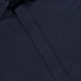 Close-up of the ETRO Jacquard Long Sleeve Dress Shirt in navy, crafted from soft cotton and featuring a subtle geometric jacquard pattern, with the collar and partially visible placket on display.