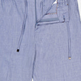 ETRO Linen Drawstring Trouser Pants in light blue feature a linen-blend fabric, elastic drawstring waist, button closure, and a partially open zipper fly with visible interior stitching detail.