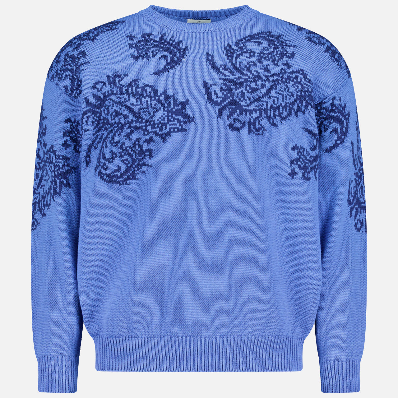 The ETRO Paisley Crewneck Sweater is a men's blue cotton pullover with long sleeves and a crew neckline, featuring dark blue paisley patterns on the chest and shoulders—perfect for spring.