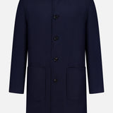 An ETRO Plaid Long Reversible Coat for men, crafted in Italian wool and dark navy blue hues, features a classic collar, button-down front, two spacious front pockets, and long sleeves. The coat is displayed on a plain white background.