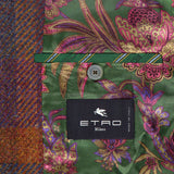 The inside of this vibrant ETRO jacket reveals a green floral-patterned lining, a buttoned pocket, and a black label displaying "ETRO Milano" alongside "Made in Italy." Perfect for fall fashion, its outer shell is crafted from multicolored tweed—ideal for layering over a wool cashmere shirt or pairing with your favorite ETRO Plaid Wool-blend Overshirt.