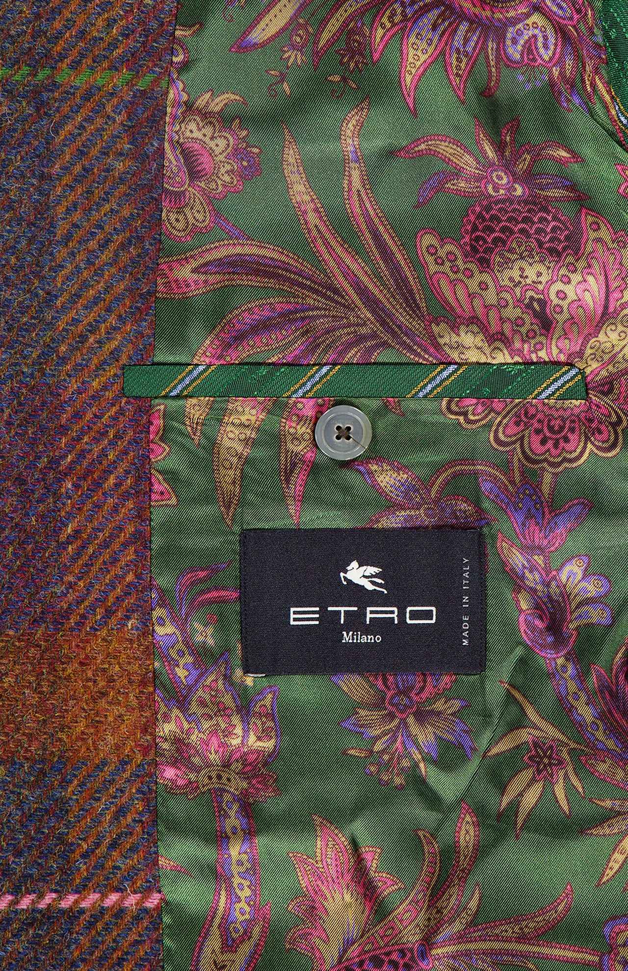 The inside of this vibrant ETRO jacket reveals a green floral-patterned lining, a buttoned pocket, and a black label displaying "ETRO Milano" alongside "Made in Italy." Perfect for fall fashion, its outer shell is crafted from multicolored tweed—ideal for layering over a wool cashmere shirt or pairing with your favorite ETRO Plaid Wool-blend Overshirt.