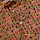 Close-up of the ETRO Roma Cotton Logo Shirt for men, featuring intricate pink, yellow, and black geometric medallion motifs in a repeating pattern. The shirt displays white buttons, a visible collar and label, evoking the stylish signature aesthetic of ETRO.