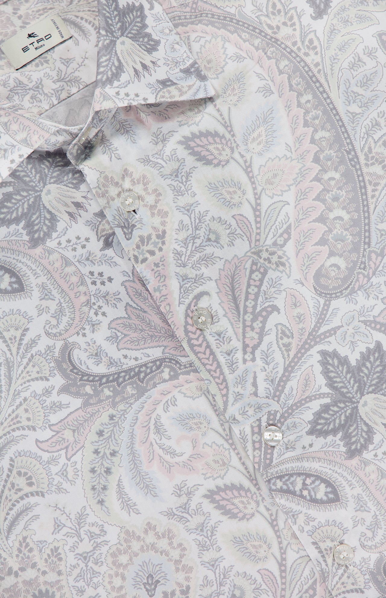Close-up of ETRO's Paisley Long Sleeve Shirt, a men's cotton dress shirt with an intricate grey, pale pink, and lavender paisley print. The light grey collar and brand label are visible at the top.
