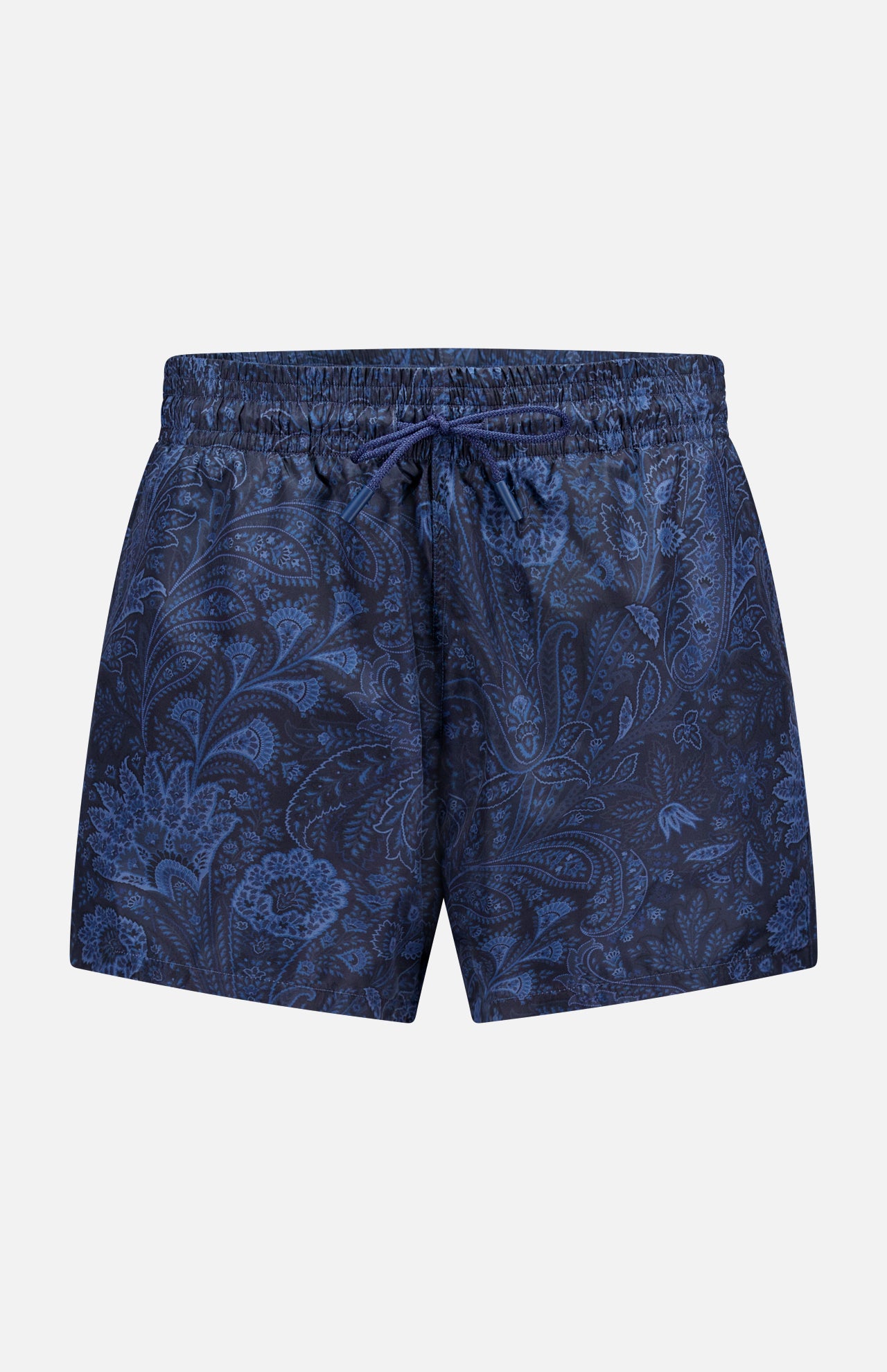 The ETRO Paisley Print Swim Trunk features a navy design with a drawstring waist and a subtle light blue paisley pattern. This stylish men's swimwear is shown on a plain light gray background.