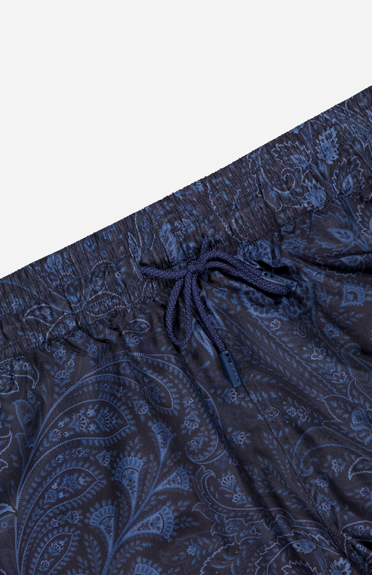 Close-up of the waistband and upper section of ETRO Paisley Print Swim Trunk in navy, featuring a paisley pattern and drawstring tie.