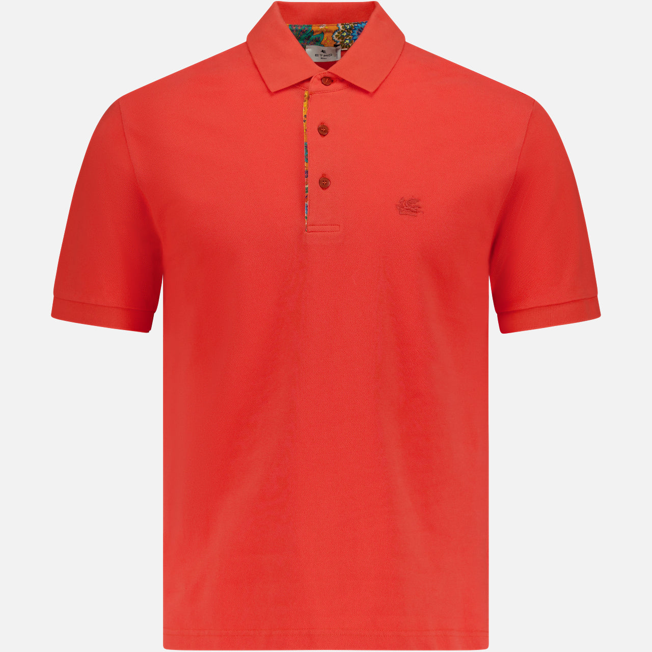 The ETRO Roma Printed Detail Polo Shirt features a bright tangerine hue, short sleeves, a collar, three buttons, and subtle logo embroidery on the left chest—an essential for men, shown on a plain white background.