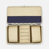 The F. HAMMANN Cowhide Jewelry Box is a rectangular, open leather case with a beige padded interior, two large side compartments, five central ring slots, and a blue accent on the lid—ideal as a travel case for your valuables.