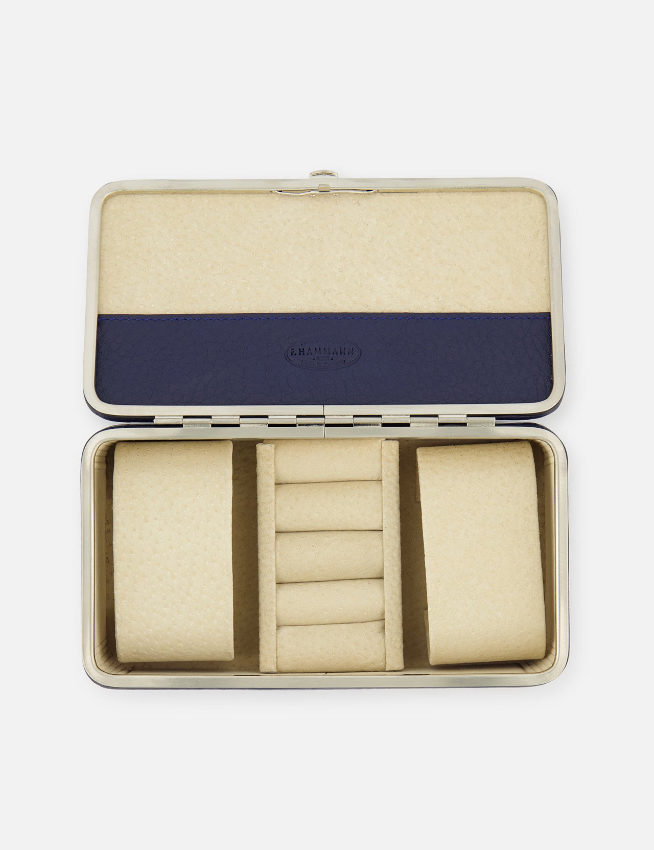 The F. HAMMANN Cowhide Jewelry Box is a rectangular, open leather case with a beige padded interior, two large side compartments, five central ring slots, and a blue accent on the lid—ideal as a travel case for your valuables.