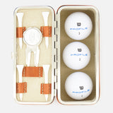 The F. HAMMANN Cowhide Golf Set, made in Germany, features a leather case with three white Wilson Profile balls, four wooden tees, a divot tool, and a ball marker, all organized in fitted compartments.