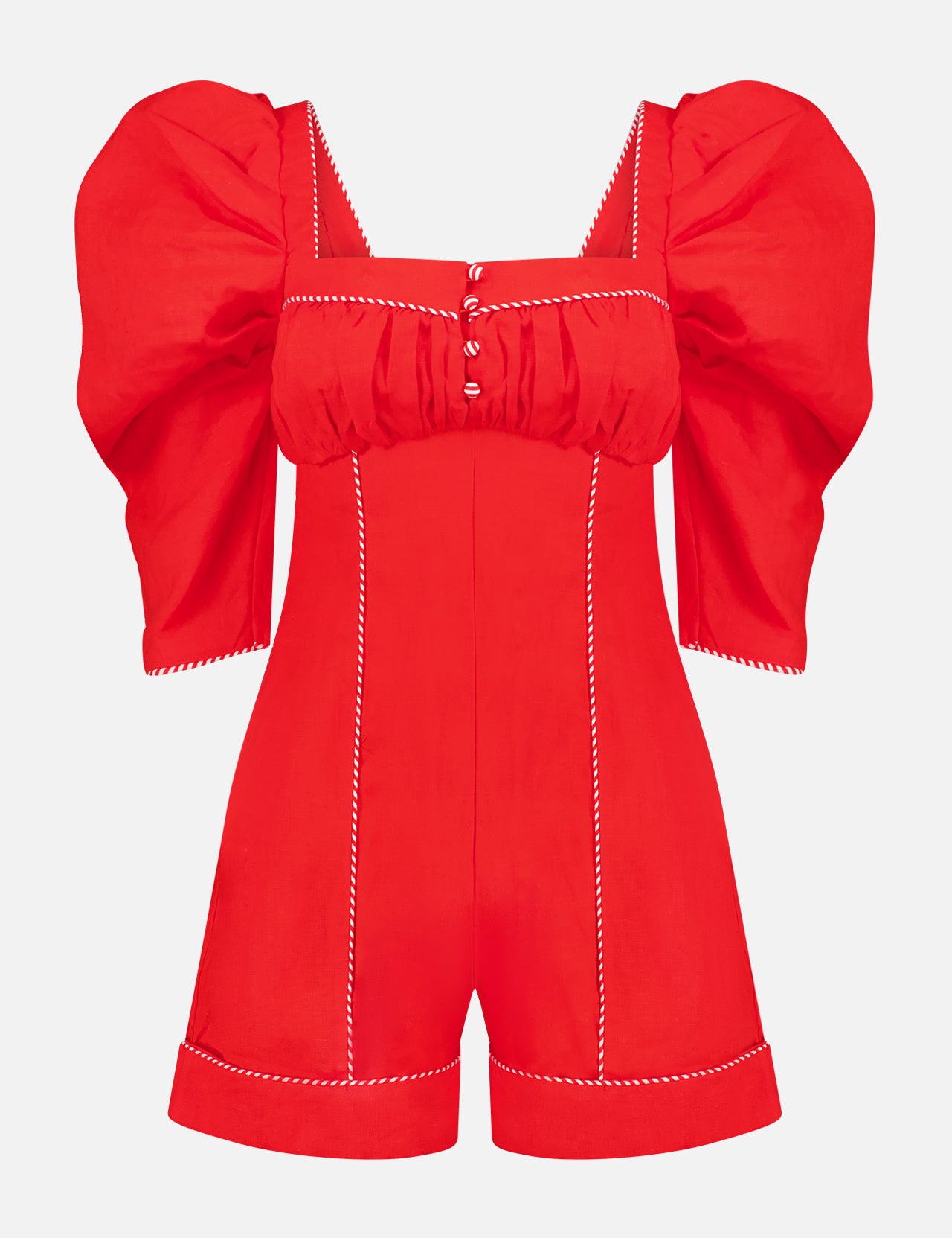 The FARM RIO Straight Neckline Short Sleeve Mini Jumpsuit features a bright red retro style with puffed sleeves, white zigzag trim, button details on the ruched bust, and stitched seam accents.