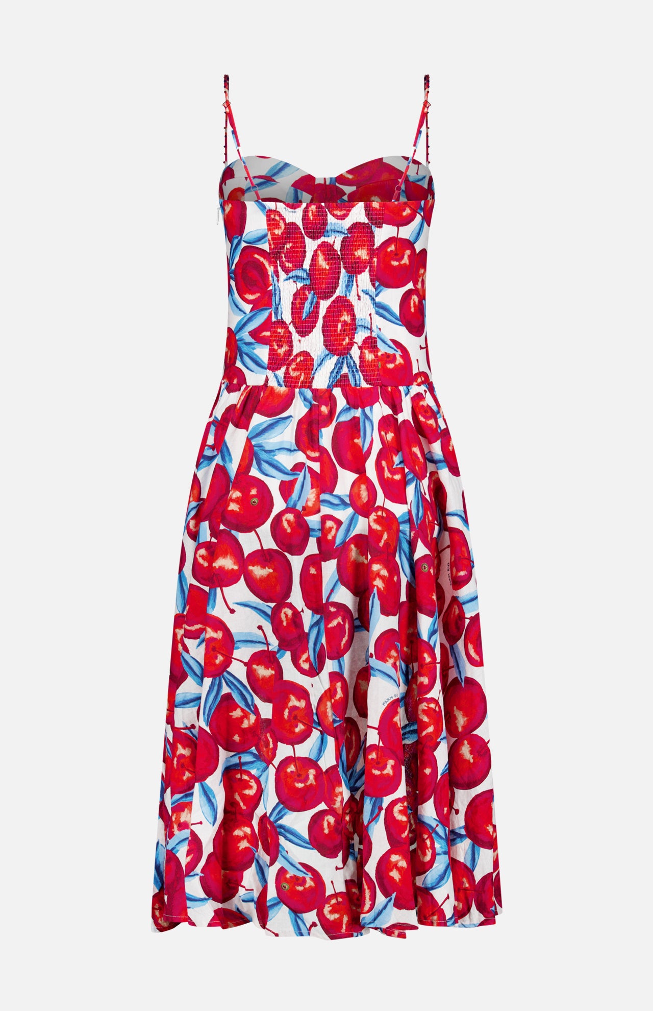 The Cherry Blossom Sleeveless Midi Dress by FARM RIO features thin straps, a fitted bodice, flared skirt, sweetheart neckline, and bold red cherry with green leaf print on white.