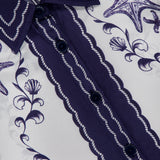 Close-up of the FARM RIO Coast Scarf Wide Sleeve Shirt in blue and white, featuring dark blue buttons and intricate ocean-inspired floral and starfish prints. Collared with a visible FARM RIO tag—perfect for vacation style.