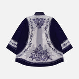 The Coast Scarf Wide Sleeve Shirt by FARM RIO is a navy blue long-sleeve top with a light lavender back panel, dark blue floral and vine embroidery, plus embroidered cuffs and hem—perfect for a stylish vacation look.