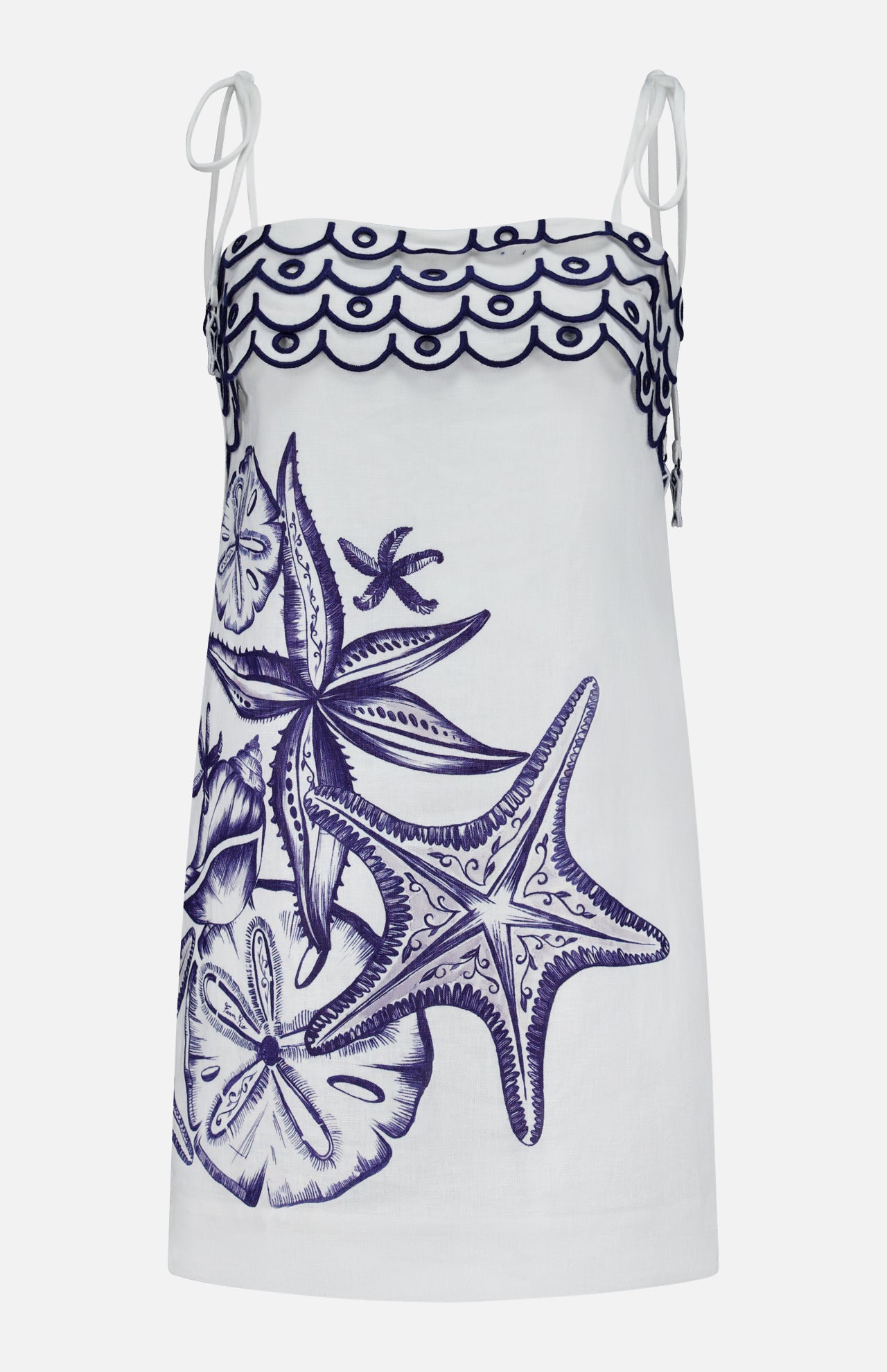 The Coast Stars Linen Mini Dress by FARM RIO is a white sleeveless mini dress with thin shoulder ties, navy embroidered starfish and seashells, plus a wavy hem—ideal as an embroidered summer dress.