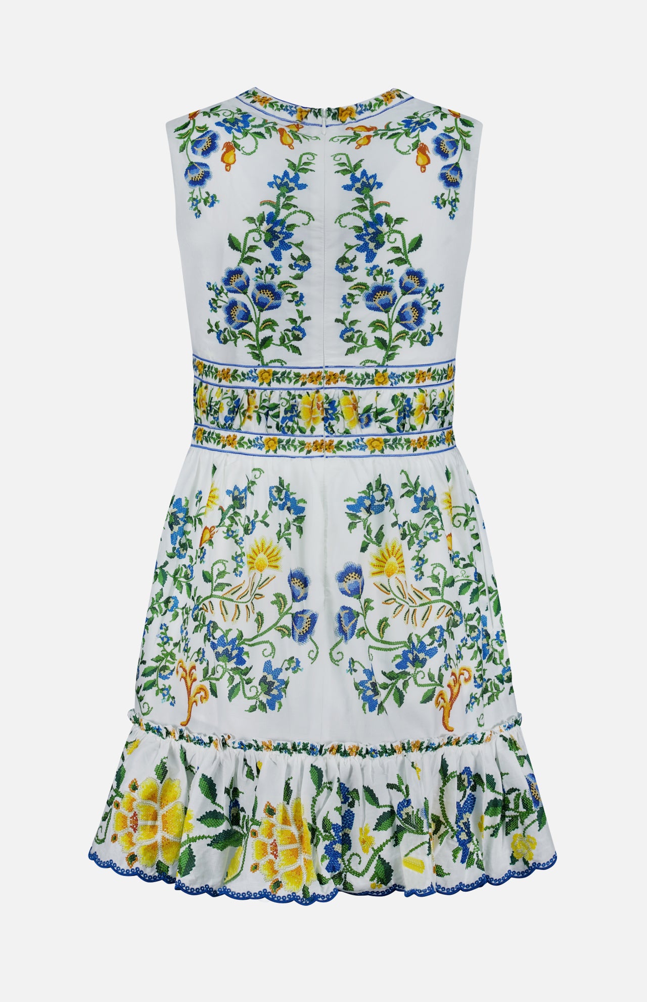 The Emily Floral Tapestry Mini Dress by FARM RIO is a sleeveless, white mini dress with a fitted waist and ruffled hem, adorned with blue, yellow, and green floral embroidery on organic cotton for a fresh, refined look.