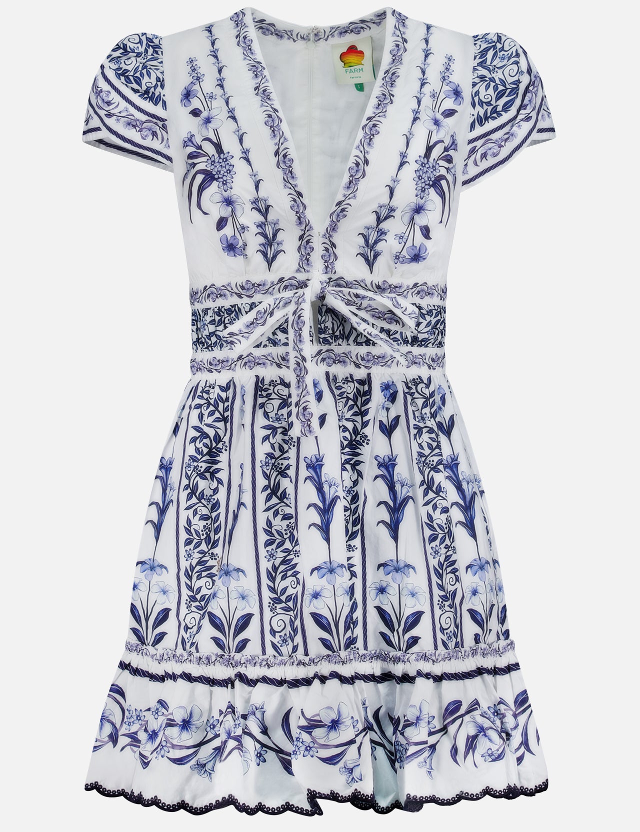The Flowers Arch Mini Dress by FARM RIO features short sleeves, a v-neckline, white and blue floral patterns, gathered front tie, fitted waist, ruffled hem with piping, and intricate vertical botanical designs for added elegance.