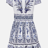 The FARM RIO Flowers Arch Mini Dress is a white and blue short-sleeved mini with purple florals, a fitted waist, ruffled hem, back zipper, intricate borders, and symmetrical botanical motifs.