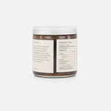 A clear plastic jar with a white lid contains FLAMINGO ESTATE’s Morita Chile Honey (19 oz), featuring a brown spread made with unfiltered honey. The back label shows nutrition facts and product info in black on a white background.