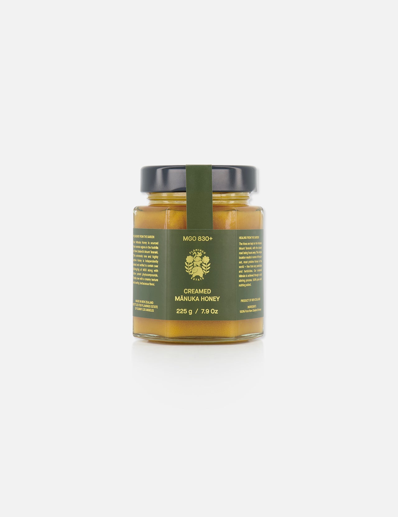 A 225g (7.9 oz) glass jar of FLAMINGO ESTATE Creamed Manuka Honey, featuring a dark green label and black lid, is displayed against a plain white background.