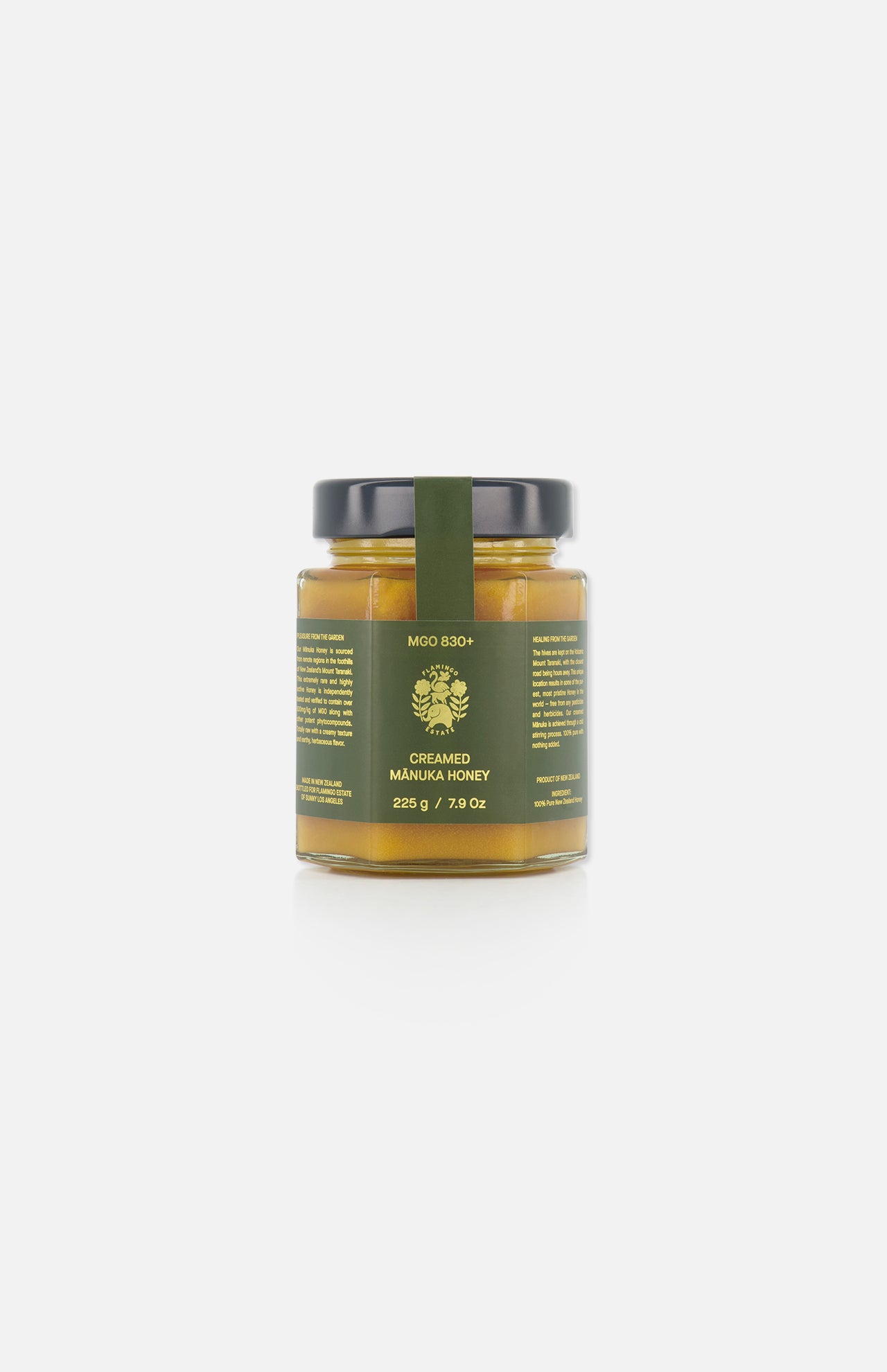 A 225g (7.9 oz) glass jar of FLAMINGO ESTATE Creamed Manuka Honey, featuring a dark green label and black lid, is displayed against a plain white background.