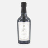 A dark glass bottle with a black cap labeled FLAMINGO ESTATE White Truffle Extra Virgin Olive Oil, featuring a minimalist white label with elegant text and a small truffle illustration, is displayed against a plain white background.