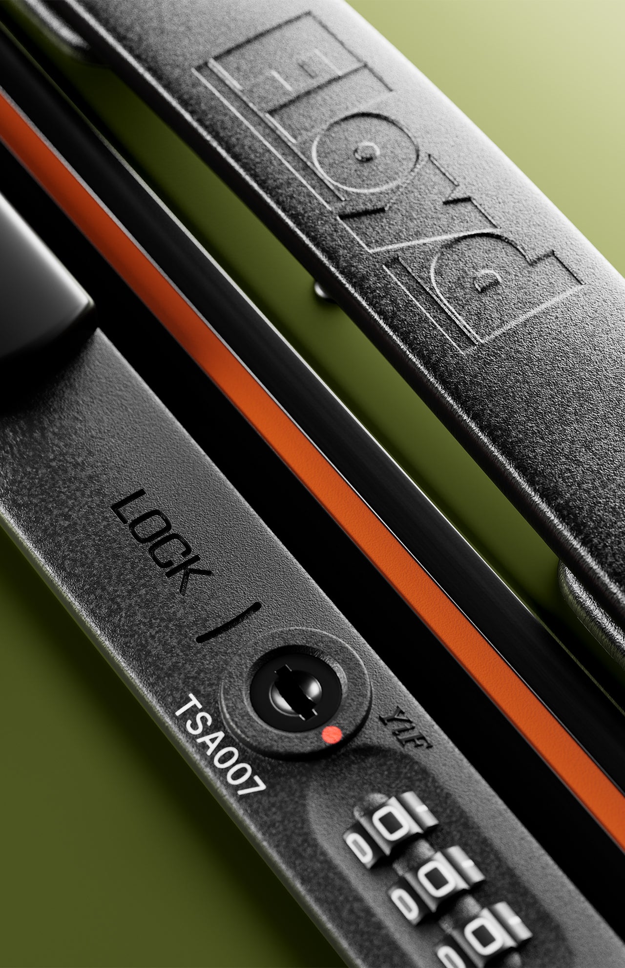 Close-up of The Bold Suitcase's black hard-top lock with combination dial and TSA007 keyhole, showing "FLOYD" embossed on the handle, set against a green background.