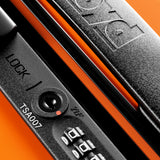 Close-up of a black combination lock with a TSA007 keyhole and zipper pull on The Cabin Suitcase by FLOYD, featuring the embossed brand name on the handle—ideal for fitting in any overhead compartment.