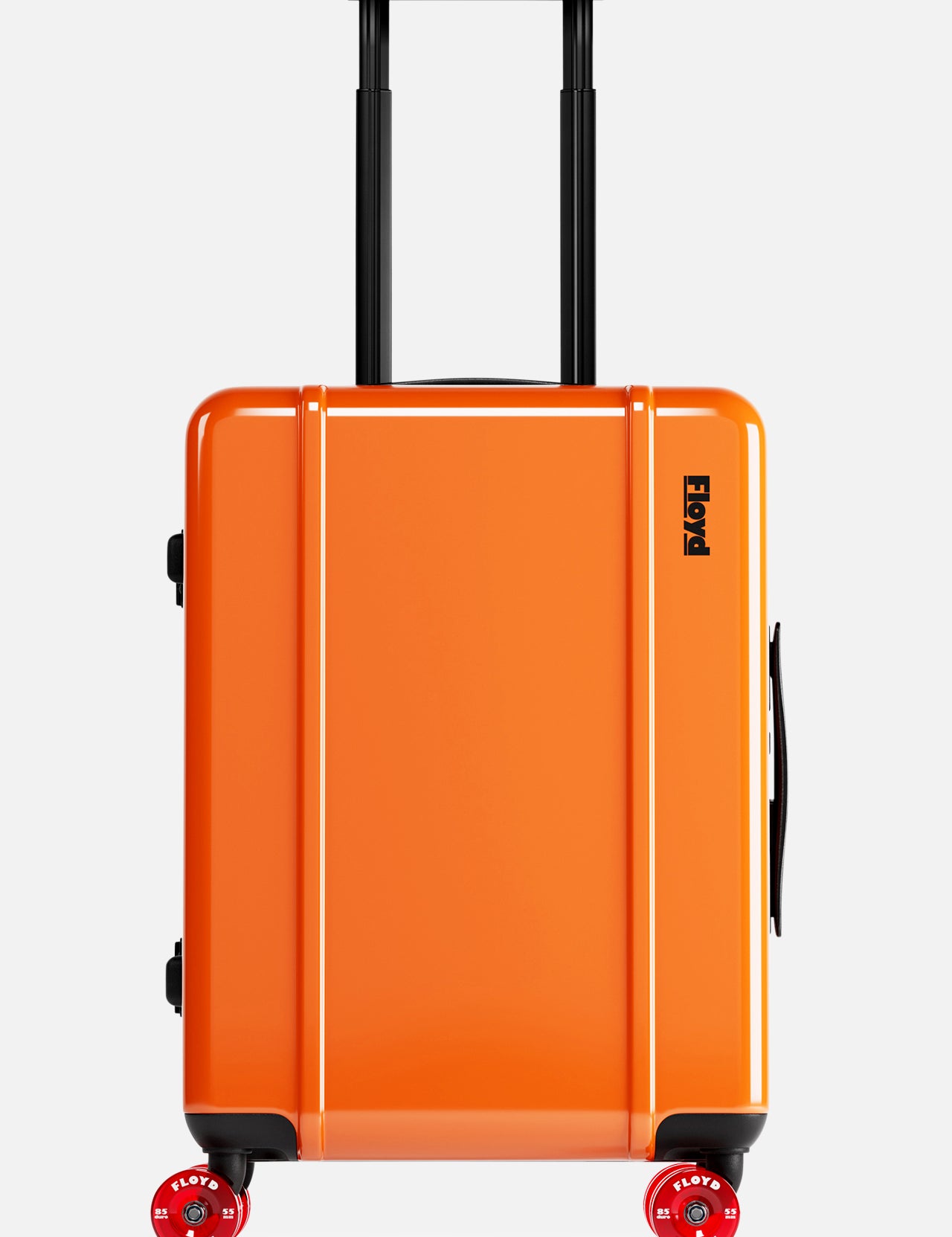 The Cabin Suitcase by FLOYD is a bright orange hard-top suitcase with a black telescopic handle and two red skateboard spinner wheels, shown standing upright against a plain white background.