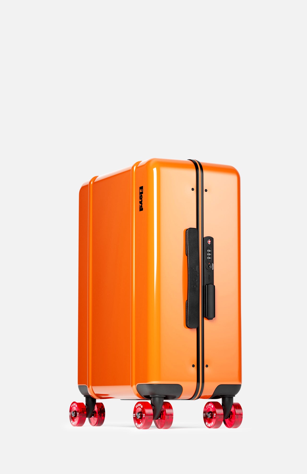 The Cabin Suitcase by FLOYD stands upright against a plain light background, featuring a bright orange hard-top shell, black handle, combination lock, and four red transparent skateboard spinner wheels. Cabin-approved size for overhead compartments.