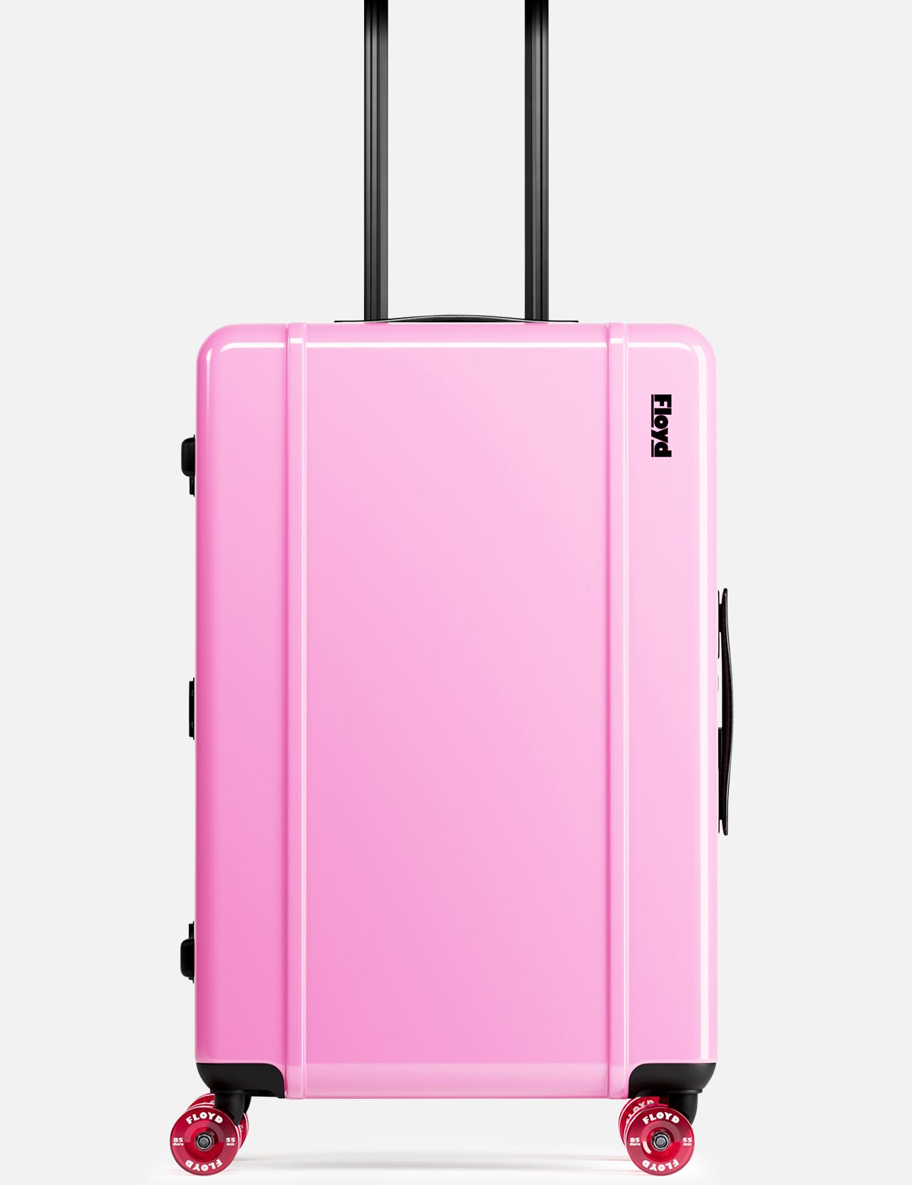The FLOYD Check-In Suitcase, a hard-top pink case with black handles, a TSA lock, and four red 360° spinner wheels, stands upright against a plain white background.
