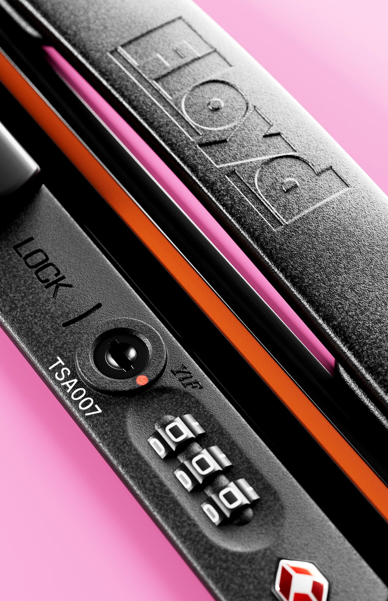 Close-up of the FLOYD Check-In Suitcase lock featuring a combination dial, TSA007 keyhole, and orange accent. "FLOYD" is embossed on the handle against a pink background.