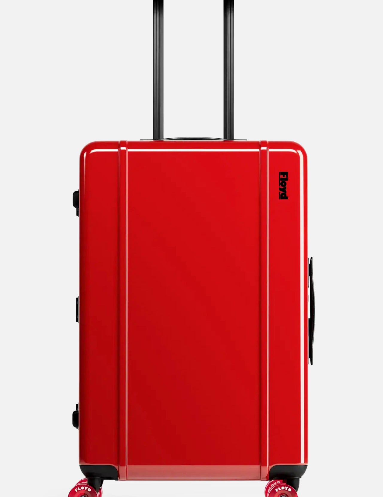 The Check-In Suitcase by FLOYD is a sleek, hard-top red suitcase featuring black handles and four red skateboard spinner wheels, pictured standing upright against a plain light background.