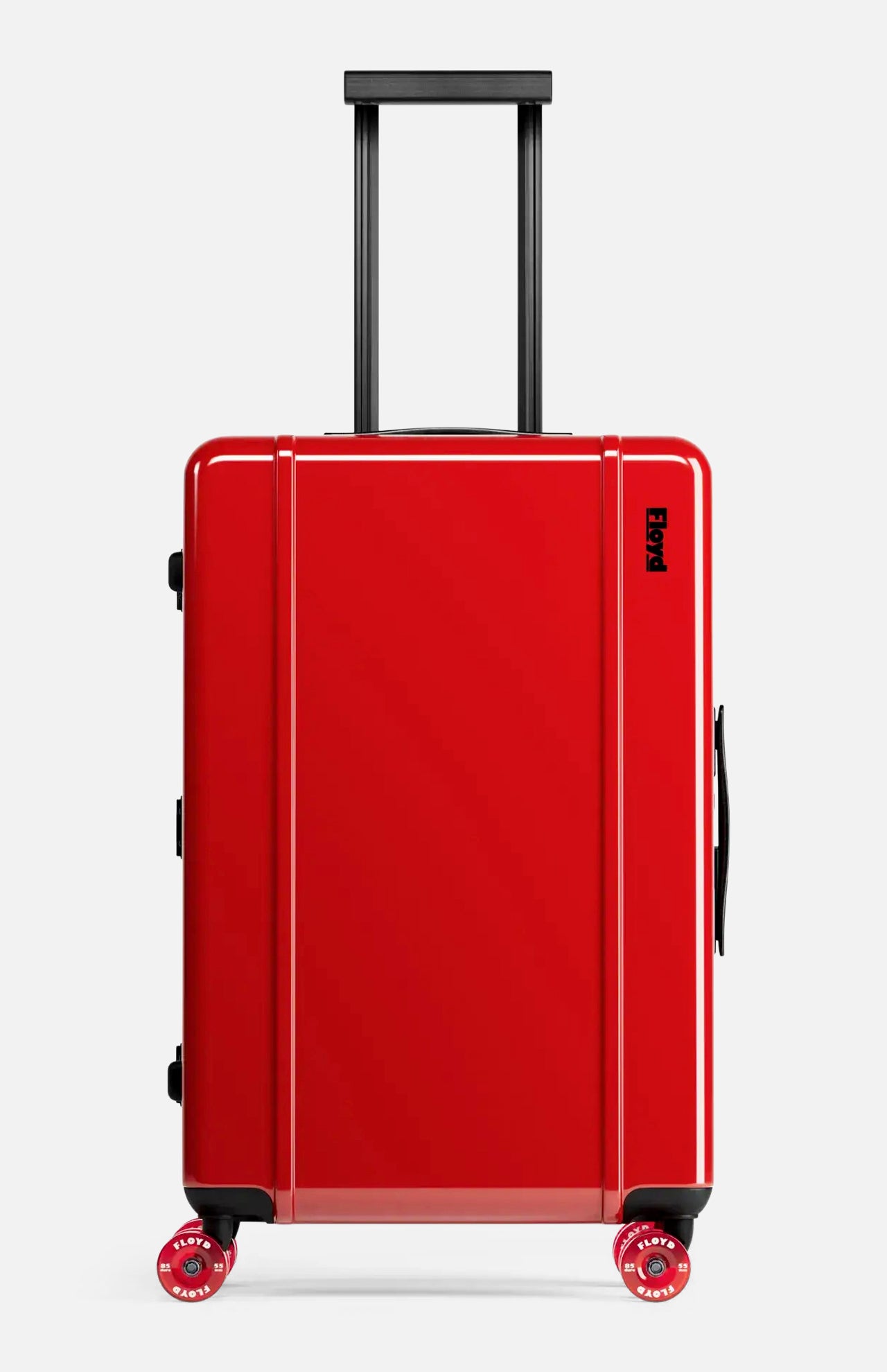 The Check-In Suitcase by FLOYD is a sleek, hard-top red suitcase featuring black handles and four red skateboard spinner wheels, pictured standing upright against a plain light background.