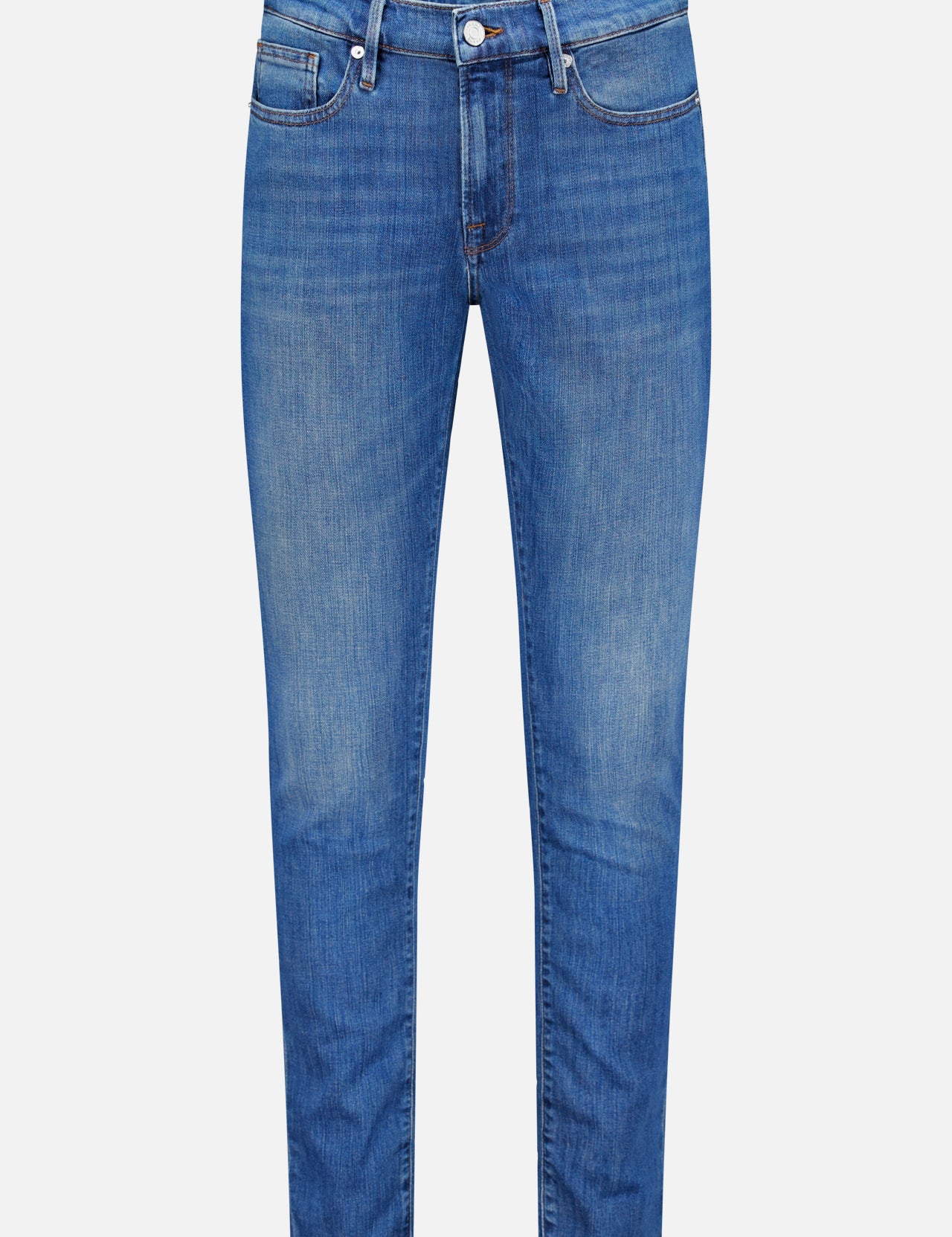The L’Homme Slim Jean in Verdugo by Frame is a pair of dark blue slim fit jeans, crafted from premium stretch denim. They feature a button and zip fly, front and back pockets, and subtle fading on the thighs and knees.