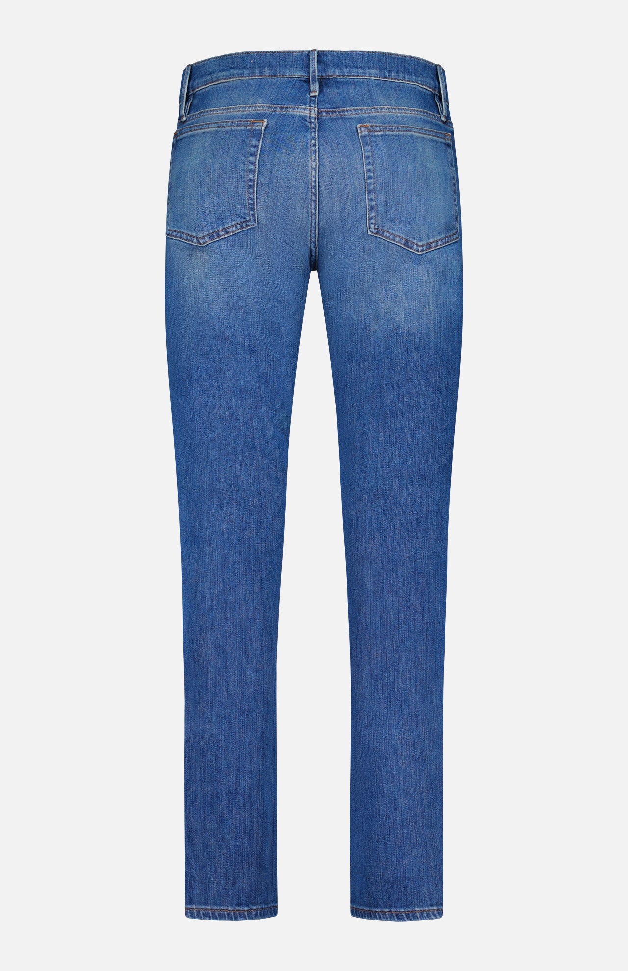 Back view of the Frame L’Homme Slim Jean in Verdugo, featuring two back pockets, belt loops, and a slim-fit silhouette crafted from premium stretch denim, all set against a plain white background.