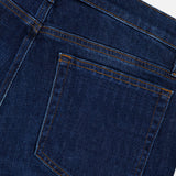 Close-up of the back pocket of the Frame L’Homme Slim Jean in Baltic, highlighting the stitching details along with a portion of the waistband and belt loop. Crafted from premium stretch denim, the fabric appears new and unworn.