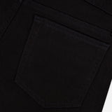 Close-up of the back pocket of Frame’s L’Homme Slim Pant in Noir, crafted from stretch denim with dark stitching and a glimpse of the waistband, set against a white background.