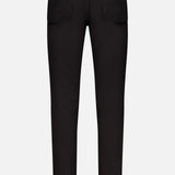 Back view of the Frame L’Homme Slim Pant in Noir, featuring two rear pockets, belt loops, and straight legs crafted from stretch denim, displayed on a plain white background.