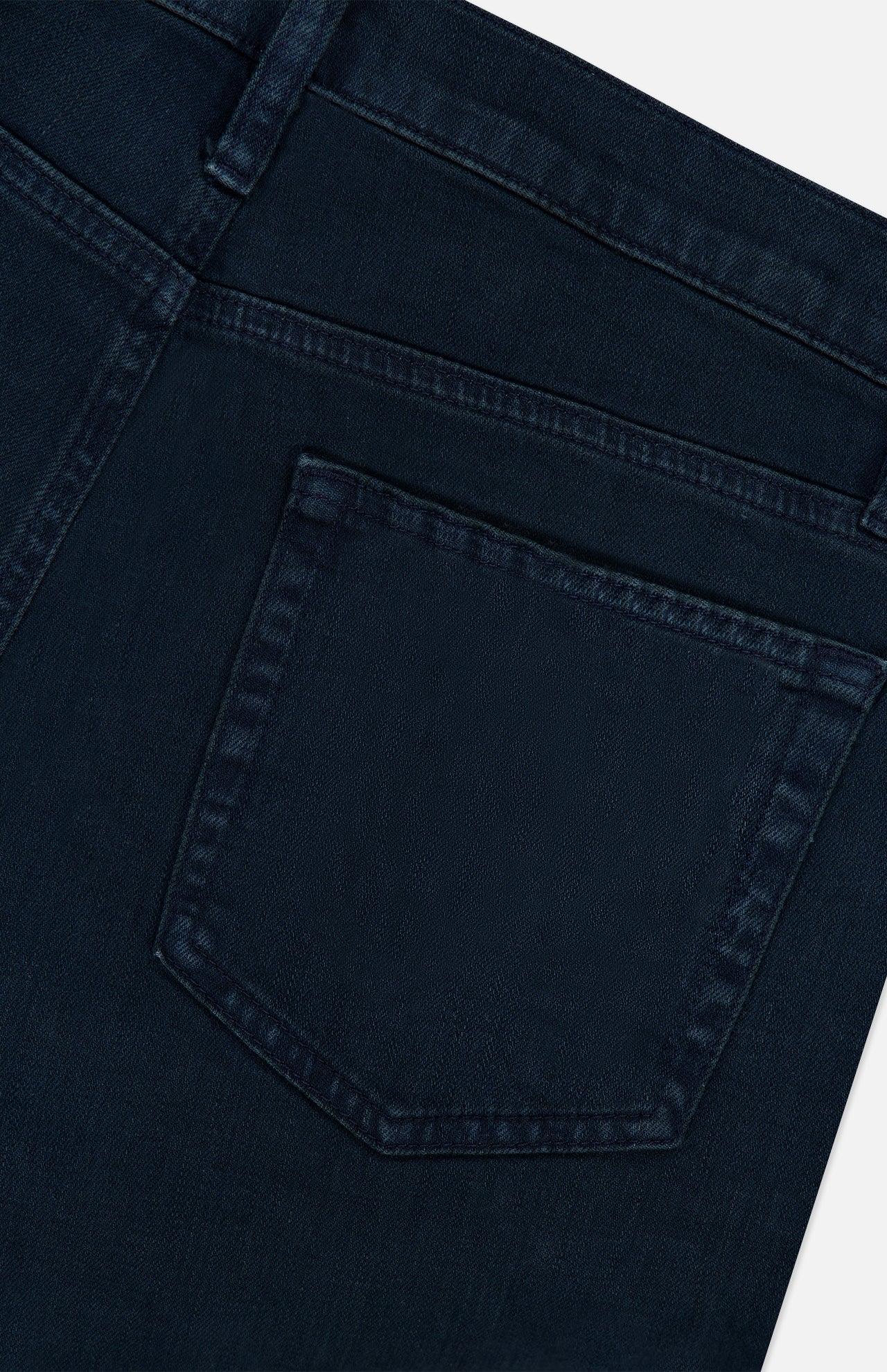Close-up of the back pocket on the FRAME Modern Straight Pant in Placid, highlighting stitching details, belt loop, and part of the waistband crafted from comfort stretch denim.