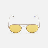 The GARRETT LEIGHT Benny J Round Natural Sunglasses feature thin metallic frames and yellow-tinted lenses, displayed against a plain white background.