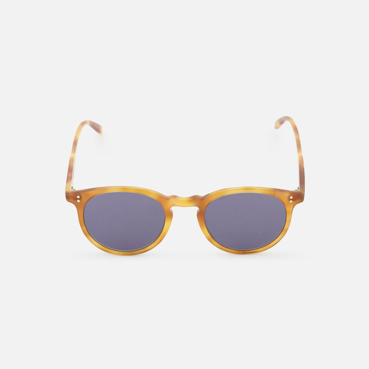 The GARRETT LEIGHT Carlton Round Tan Sunglasses feature amber-hued, bio-based acetate frames and dark lenses, shown against a plain white background.