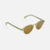 The GARRETT LEIGHT Casillas Round Sea Glass Sunglasses feature light green, semi-transparent oval acetate frames and brown tinted lenses, displayed at an angle on a white background.
