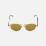 The Casillas Round Sea Glass Sunglasses by GARRETT LEIGHT feature olive green oval lenses, transparent acetate frames, and yellowish-brown tints, shown on a plain white background.