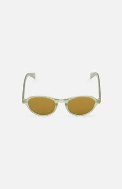The Casillas Round Sea Glass Sunglasses by GARRETT LEIGHT feature olive green oval lenses, transparent acetate frames, and yellowish-brown tints, shown on a plain white background.