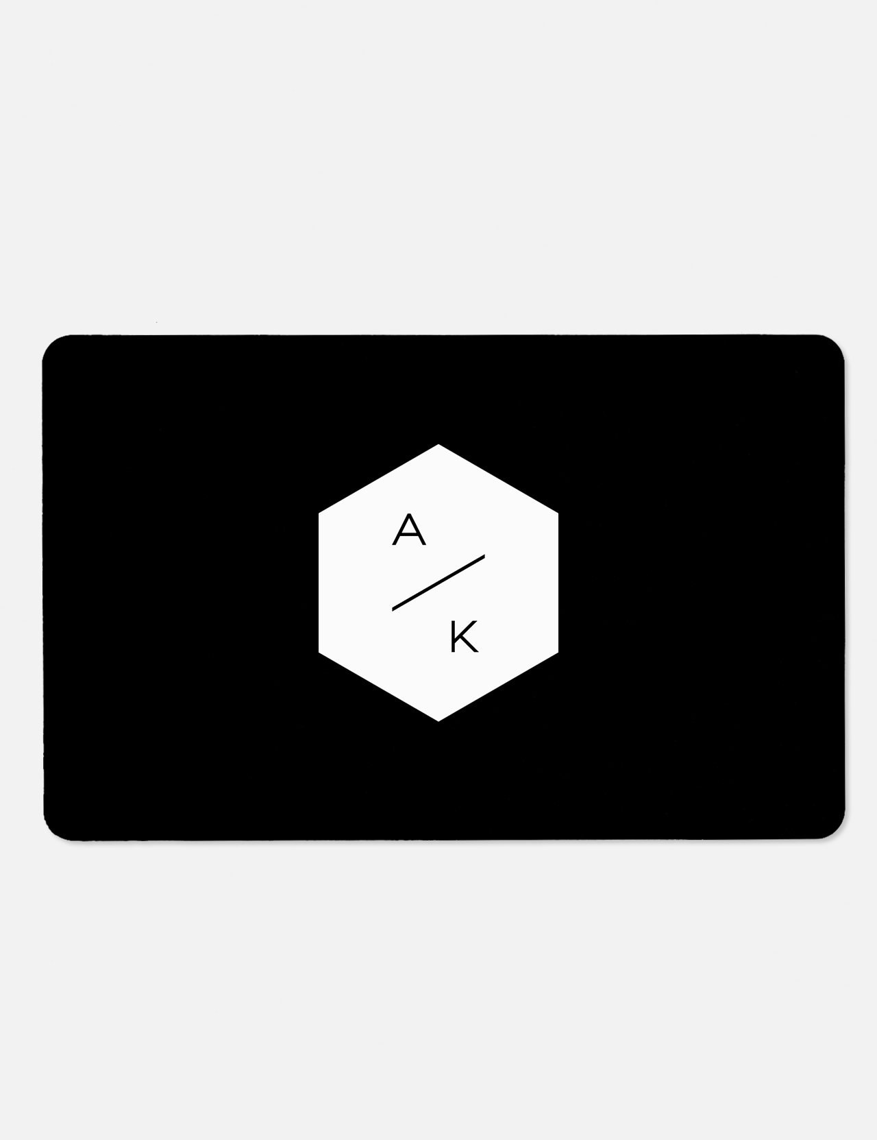 A black rectangular E-Gift Card by A.K. Rikk's features a white central hexagon with ‘A’ above a line and ‘K’ below it—an ideal choice for gifting luxury shopping at A.K. Rikk's.