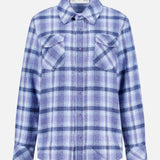 The Plaid Cashmere Shirt with Amethyst Button by God’s True Cashmere features a blue and white plaid pattern, long sleeves, a collared neckline, and two chest pockets. Displayed on a plain white background, this classic unisex shirt is crafted for both comfort and style.