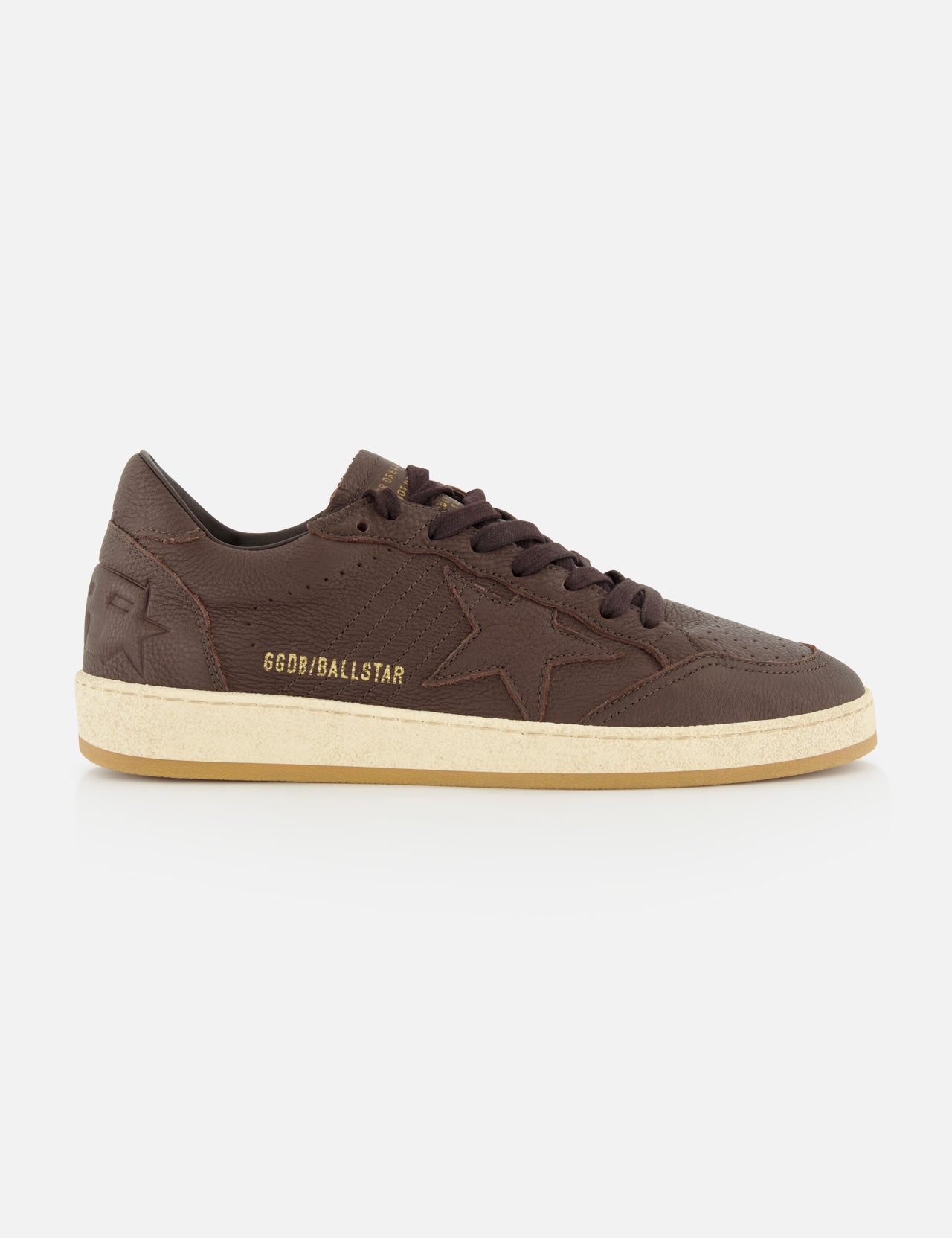 Side view of the BALLSTAR Leather Upper Sneaker by GOLDEN GOOSE in brown leather, featuring a star design, beige scuffed sole, and GGDB/BALLSTAR text on the side, photographed against a plain white background.