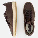 A pair of GOLDEN GOOSE Ballstar Leather Upper Sneakers in dark brown leather with white rubber soles is shown from side and top views, featuring perforated toe detailing, a subtly distressed sole, and BALLSTAR branding on the insole.